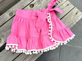 SEVILLE SKIRT COVER UP IN PINK WITH WHITE POMPONS