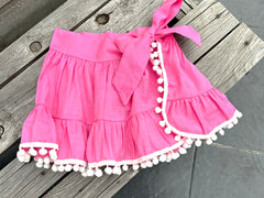 SEVILLE SKIRT COVER UP IN PINK WITH WHITE POMPONS